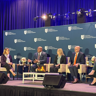 Billy Hensley participates in a panel discussion at the National Association of Attorneys General event in Washington, D.C. on the state of financial education.