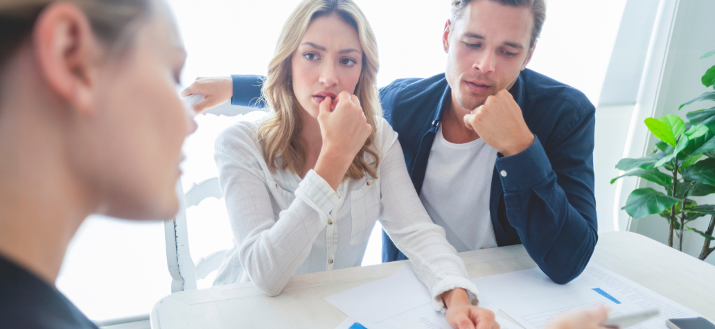 A couple look over financial documents